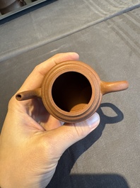 A collection of 20 Chinese Yixing stoneware teapots, 20th C.