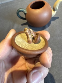 A collection of 20 Chinese Yixing stoneware teapots, 20th C.