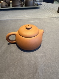 A collection of 20 Chinese Yixing stoneware teapots, 20th C.