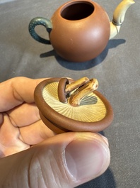 A collection of 20 Chinese Yixing stoneware teapots, 20th C.