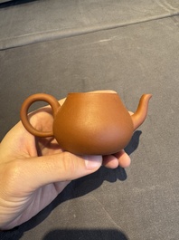 A collection of 20 Chinese Yixing stoneware teapots, 20th C.