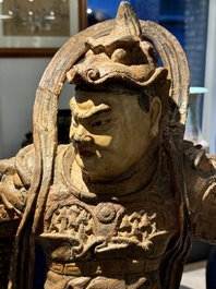 A large Chinese polychrome-lacquered wooden figure of a Guardian King, 18/19th C.