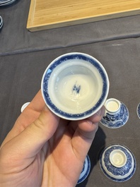 A collection of 32 pieces Chinese blue and white cups, saucers and covers with floral design, Qianlong