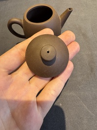 A collection of 20 Chinese Yixing stoneware teapots, 20th C.