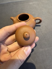 A collection of 20 Chinese Yixing stoneware teapots, 20th C.