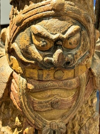A large Chinese polychrome-lacquered wooden figure of a Guardian King, 18/19th C.