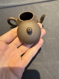 A collection of 20 Chinese Yixing stoneware teapots, 20th C.