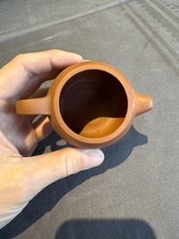 A collection of 20 Chinese Yixing stoneware teapots, 20th C.
