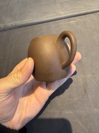 A collection of 20 Chinese Yixing stoneware teapots, 20th C.