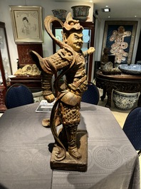 A large Chinese polychrome-lacquered wooden figure of a Guardian King, 18/19th C.