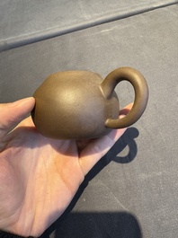 A collection of 20 Chinese Yixing stoneware teapots, 20th C.