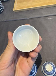 A collection of 32 pieces Chinese blue and white cups, saucers and covers with floral design, Qianlong