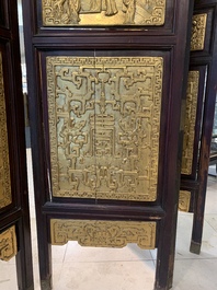 A Chinese four-part reticulated and partially gilt wooden folding screen, 19th C.