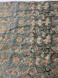 A Chinese green-ground embroidered silk panel with dragons among clouds, 18th C.