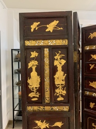 A Chinese four-part reticulated and partially gilt wooden folding screen, 19th C.