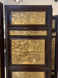 A Chinese four-part reticulated and partially gilt wooden folding screen, 19th C.