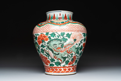 A Chinese wucai 'Buddhist lion and peony scroll' vase, Transitional period