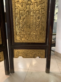 A Chinese four-part reticulated and partially gilt wooden folding screen, 19th C.