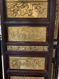 A Chinese four-part reticulated and partially gilt wooden folding screen, 19th C.