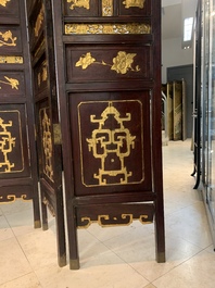 A Chinese four-part reticulated and partially gilt wooden folding screen, 19th C.