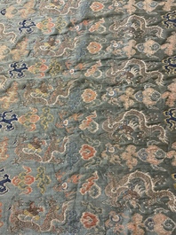 A Chinese green-ground embroidered silk panel with dragons among clouds, 18th C.