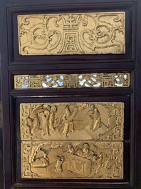 A Chinese four-part reticulated and partially gilt wooden folding screen, 19th C.