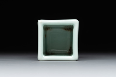 A Chinese blue and white celadon-ground square brush pot, Qianlong mark, 19/20th C.