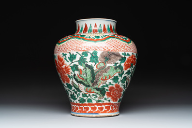 A Chinese wucai 'Buddhist lion and peony scroll' vase, Transitional period
