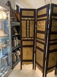A Chinese four-part reticulated and partially gilt wooden folding screen, 19th C.