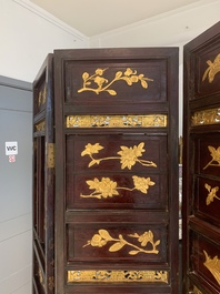 A Chinese four-part reticulated and partially gilt wooden folding screen, 19th C.