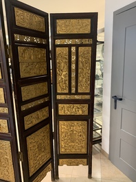 A Chinese four-part reticulated and partially gilt wooden folding screen, 19th C.