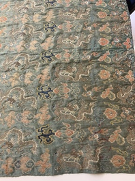 A Chinese green-ground embroidered silk panel with dragons among clouds, 18th C.