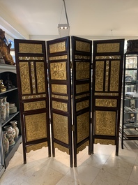 A Chinese four-part reticulated and partially gilt wooden folding screen, 19th C.