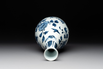 A Chinese blue and white 'birds among flowering branches' bottle vase, Ming