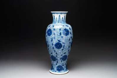A Chinese blue and white 'chrysanthemum scroll' baluster vase, Kangxi