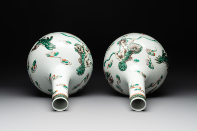 A pair of Chinese famille verte relief-decorated 'animals' vases, 19th C.