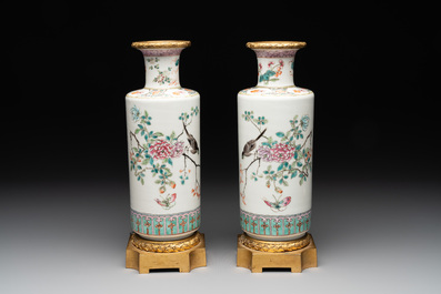 A pair of Chinese famille rose gilt-bronze-mounted 'birds among flowering branches' vases, 19th C.