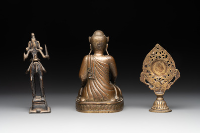 A Burmese gilt bronze Buddha, an Indian bronze Shiva on horseback and and a Nepalese Melong ritual mirror with Ganesh, 18/19th C.