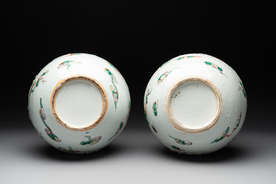 A pair of Chinese famille verte relief-decorated 'animals' vases, 19th C.