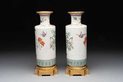 A pair of Chinese famille rose gilt-bronze-mounted 'birds among flowering branches' vases, 19th C.