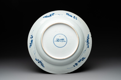 A Chinese blue and white 'mountainous river landscape' dish, lozenge mark, Kangxi
