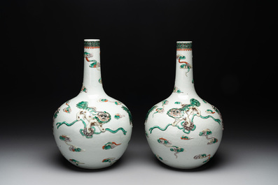 A pair of Chinese famille verte relief-decorated 'animals' vases, 19th C.