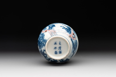 A Chinese blue, white and copper-red 'monkeys' snuff bottle, Yongzheng mark, 19th C.