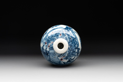 A Chinese blue, white and copper-red 'monkeys' snuff bottle, Yongzheng mark, 19th C.