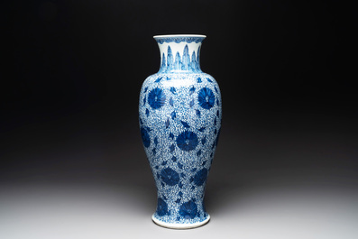 A Chinese blue and white 'chrysanthemum scroll' baluster vase, Kangxi