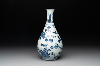 A Chinese blue and white 'birds among flowering branches' bottle vase, Ming