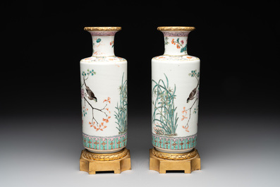 A pair of Chinese famille rose gilt-bronze-mounted 'birds among flowering branches' vases, 19th C.