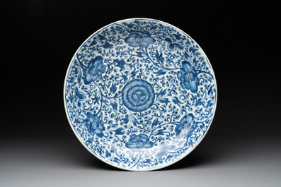 A Chinese blue and white 'lotus' jardini&egrave;re, a 'peony' dish and a 'shou' bowl, Kangxi