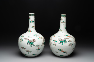 A pair of Chinese famille verte relief-decorated 'animals' vases, 19th C.