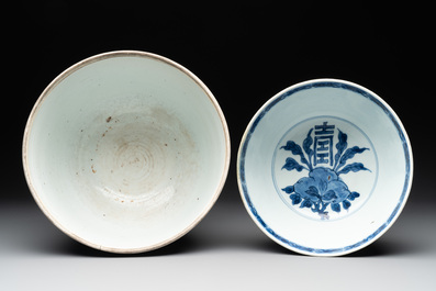 A Chinese blue and white 'lotus' jardini&egrave;re, a 'peony' dish and a 'shou' bowl, Kangxi